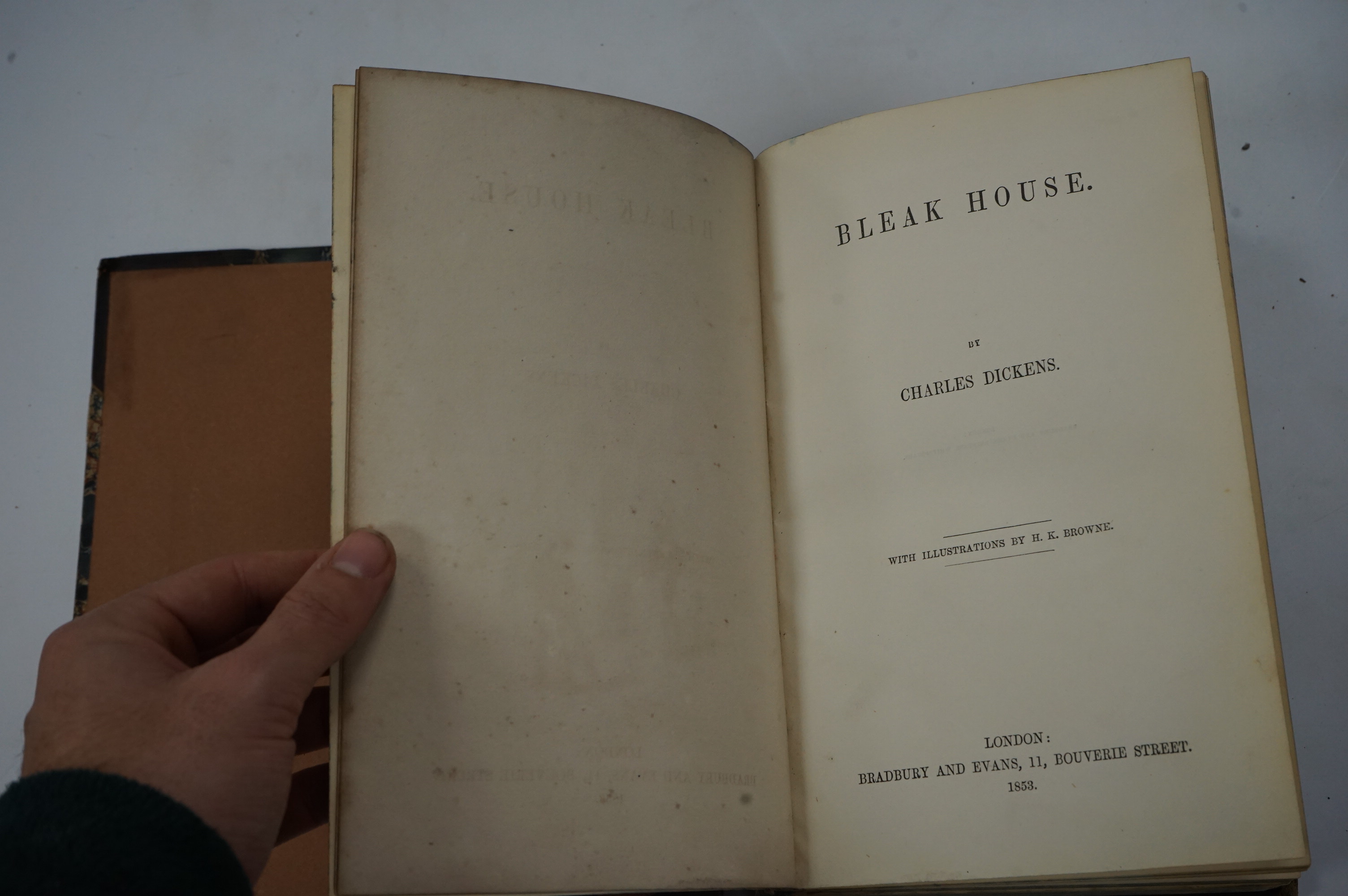 Dickens, Charles - Bleak House. First Edition. pictorial engraved and printed titles, frontis and 38 plates (by H.K. Browne); contemp. half calf and marbled boards (distressed), gilt decorated panelled spine and marbled